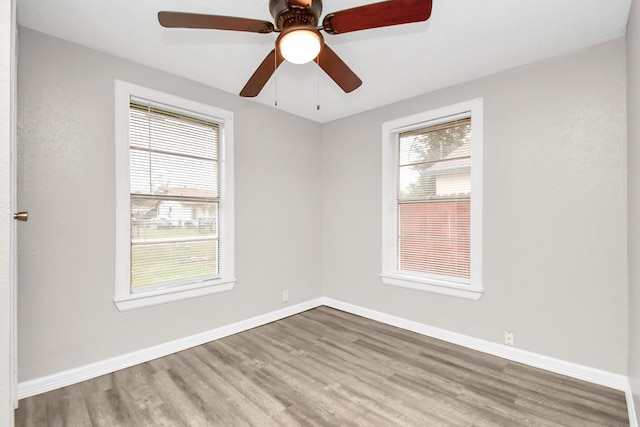 unfurnished room with wood-type flooring and ceiling fan