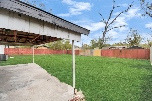 view of yard featuring cooling unit and a patio