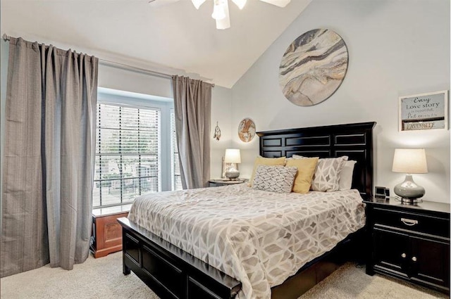 bedroom with light carpet, ceiling fan, and lofted ceiling