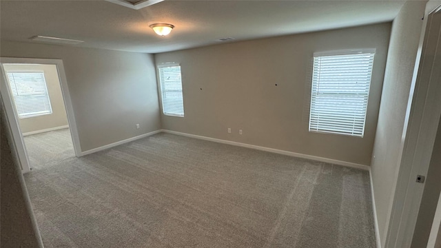 2925 Terrace Grove Dr, Conroe, TX 77304 - carpeted empty room featuring baseboards