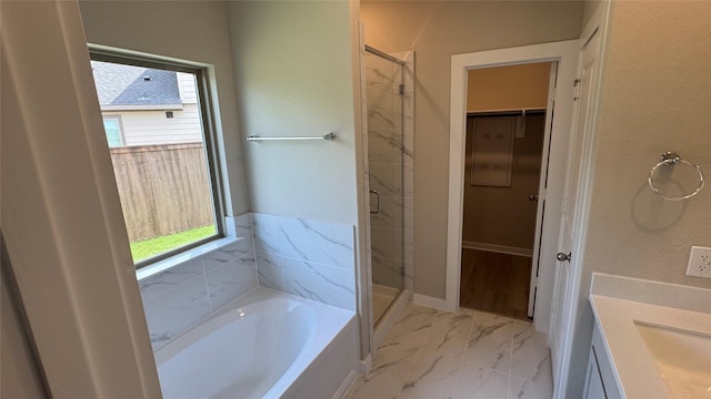 2925 Terrace Grove Dr, Conroe, TX 77304 - bathroom featuring a garden tub, a stall shower, vanity, and marble finish flooring