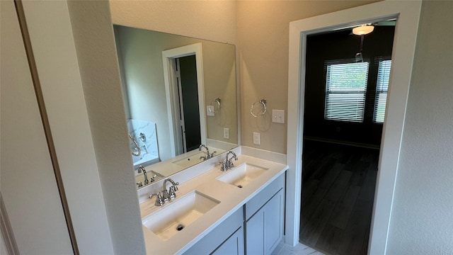 2925 Terrace Grove Dr, Conroe, TX 77304 - bathroom with double vanity and wood finished floors