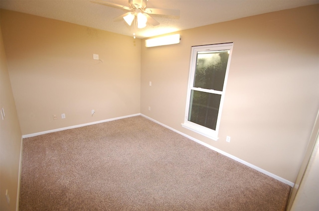 spare room with carpet flooring and ceiling fan