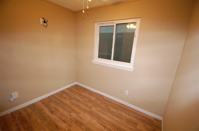 empty room featuring ceiling fan and hardwood / wood-style floors