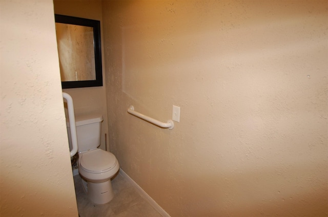 bathroom with tile patterned flooring and toilet