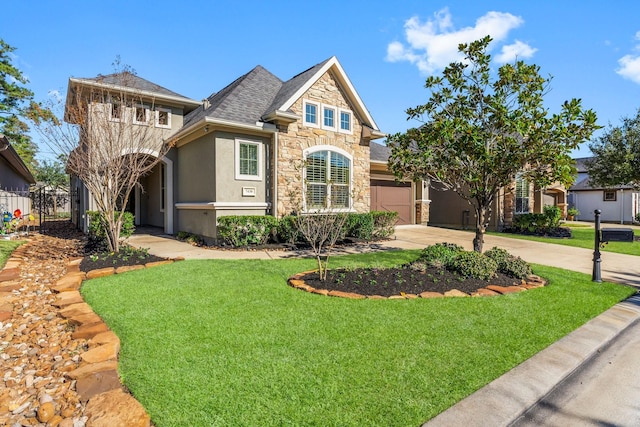 view of front of property with a front yard and a garage