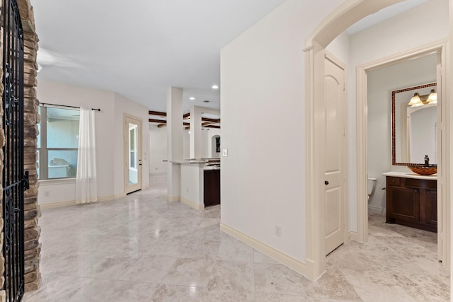 hallway featuring sink