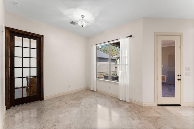 spare room featuring french doors