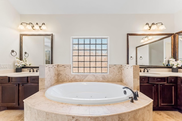 bathroom with vanity and a relaxing tiled tub