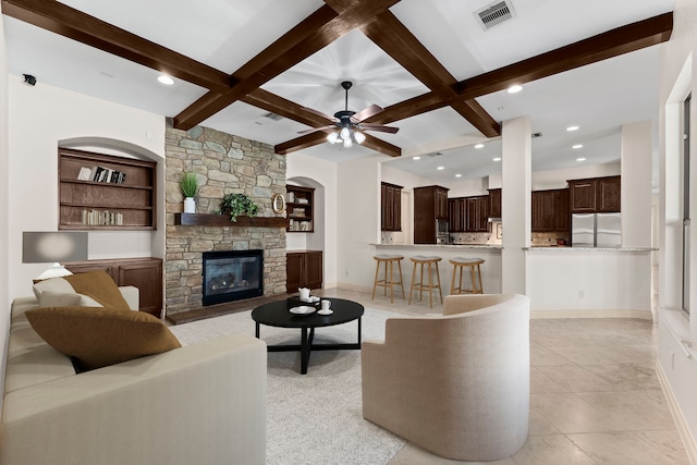 tiled living room with beamed ceiling, built in features, and coffered ceiling