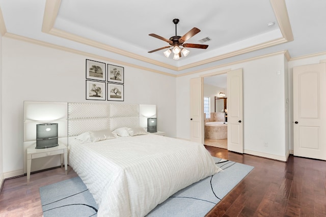 bedroom featuring a tray ceiling, ceiling fan, and dark hardwood / wood-style flooring