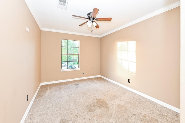 carpeted empty room with ceiling fan and ornamental molding