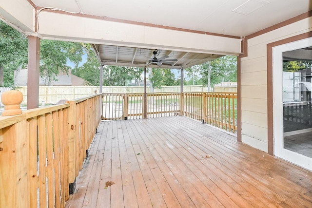 wooden deck featuring ceiling fan