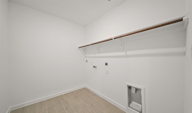 laundry room featuring hookup for a washing machine, gas dryer hookup, wood-type flooring, and hookup for an electric dryer