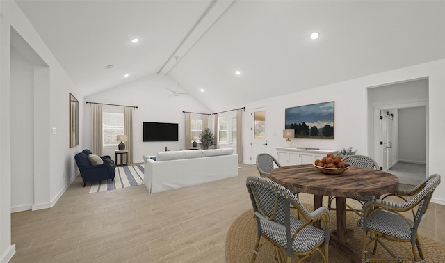 dining space featuring ceiling fan, beam ceiling, and high vaulted ceiling