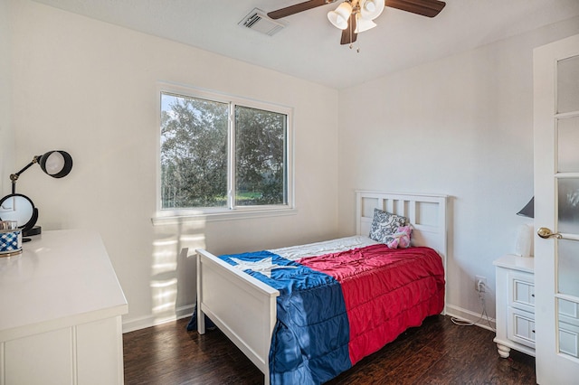 bedroom featuring ceiling fan and dark wood-type flooring