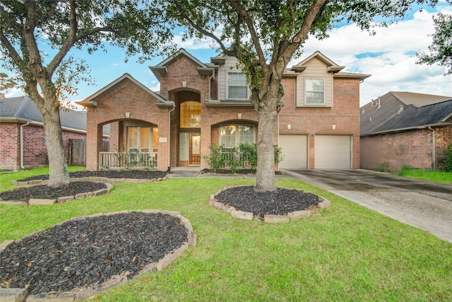 view of front property featuring a garage and a front lawn