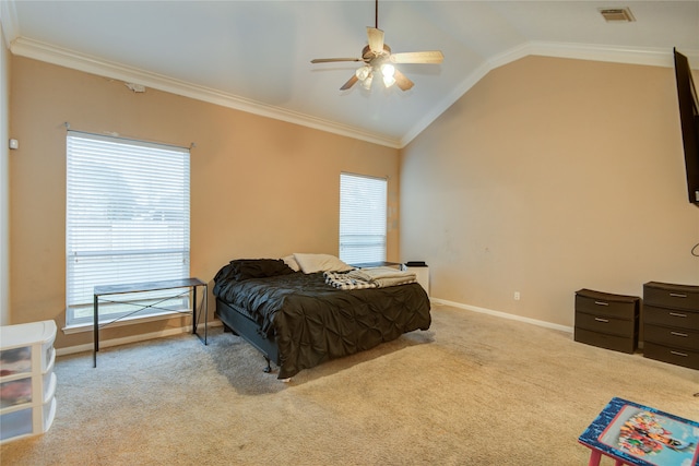 bedroom with ceiling fan, crown molding, light carpet, and vaulted ceiling