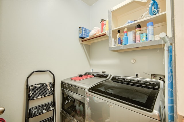 washroom featuring independent washer and dryer and heating unit