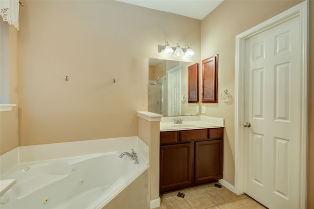 bathroom featuring tile patterned flooring, vanity, and shower with separate bathtub