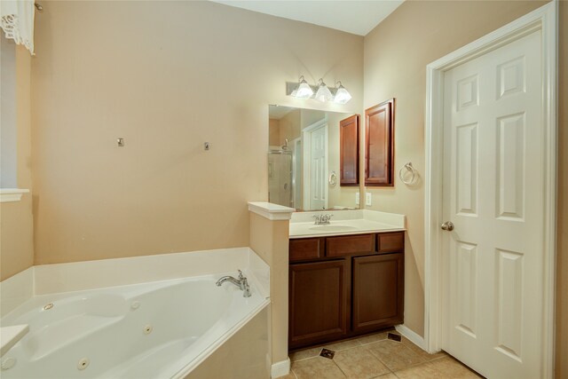 bathroom with vanity, tile patterned flooring, and plus walk in shower