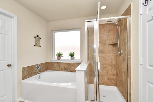 bathroom with shower with separate bathtub