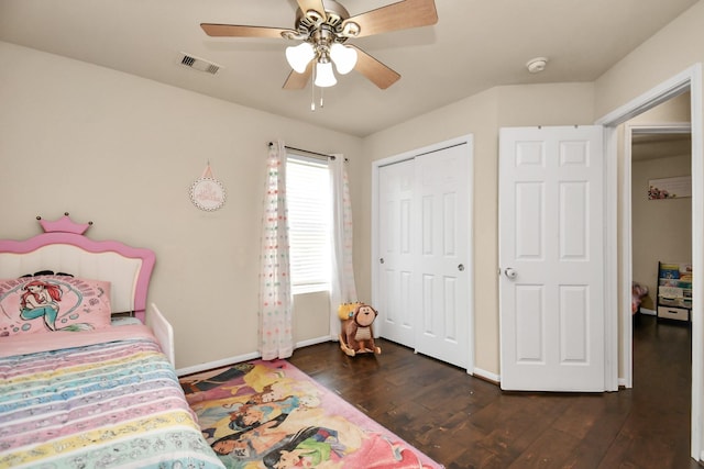 bedroom with ceiling fan and dark wood-type flooring