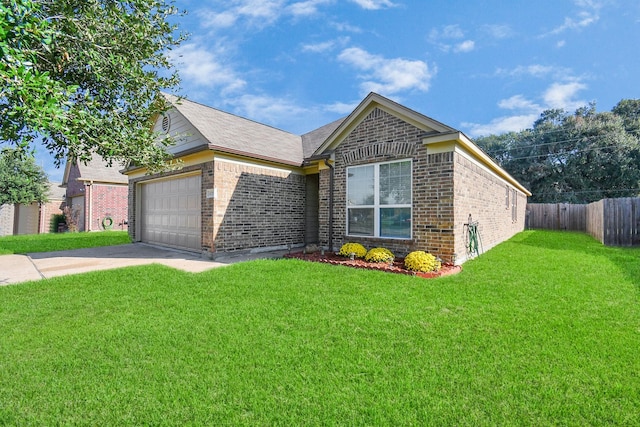 view of front of property with a garage and a front yard