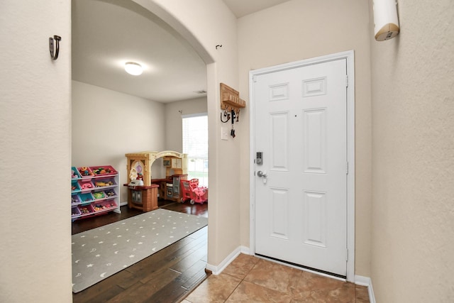 entryway with light hardwood / wood-style floors