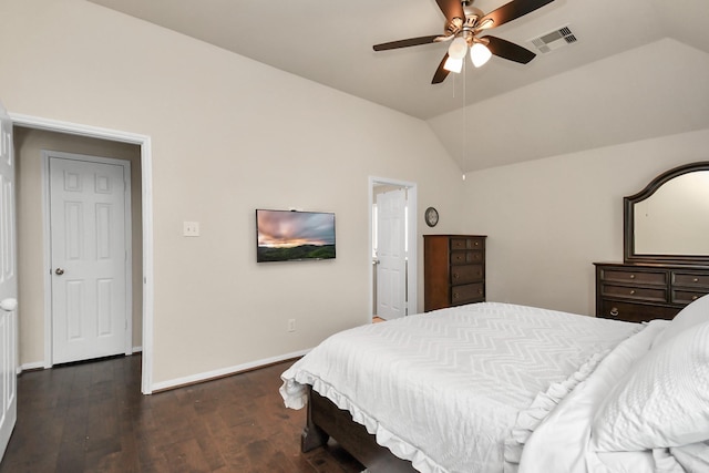 bedroom featuring ceiling fan, dark wood-type flooring, and lofted ceiling