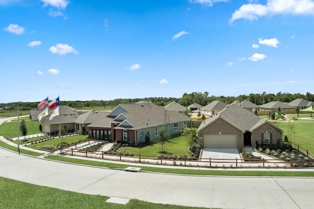 ranch-style house with a garage and a front lawn