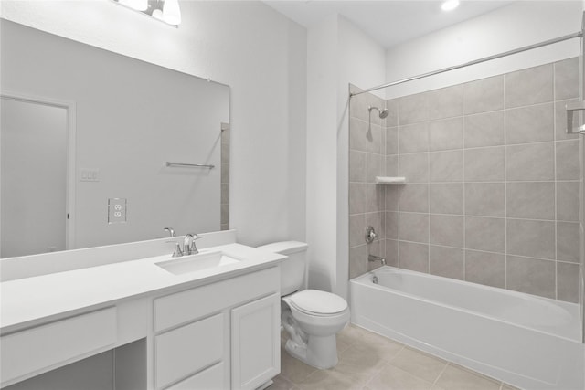 bathroom featuring toilet, vanity, tile patterned flooring, and washtub / shower combination