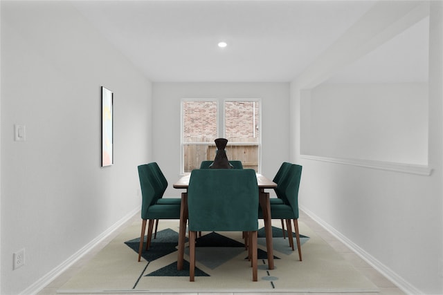 dining room with recessed lighting and baseboards