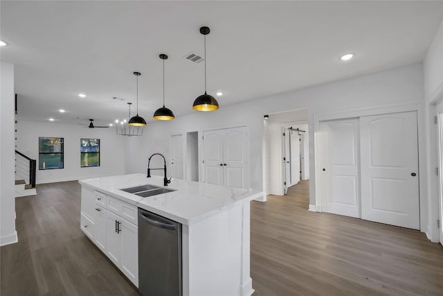 kitchen featuring white cabinets, ceiling fan, a kitchen island with sink, sink, and dishwasher