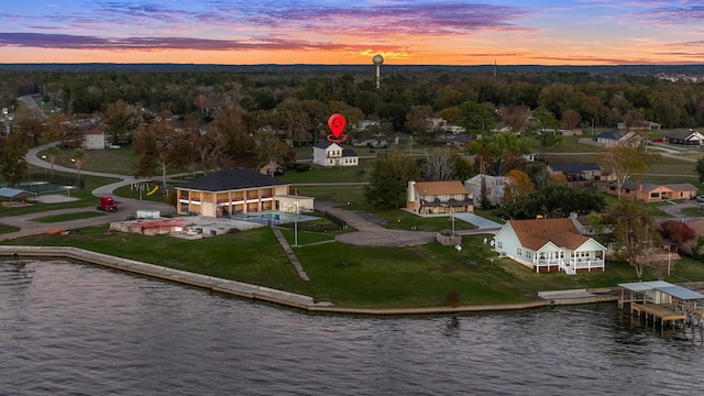 aerial view at dusk with a water view