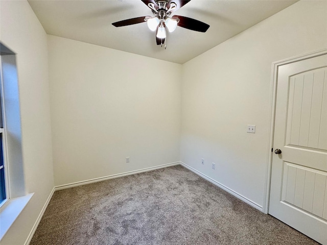 unfurnished room with light colored carpet and ceiling fan