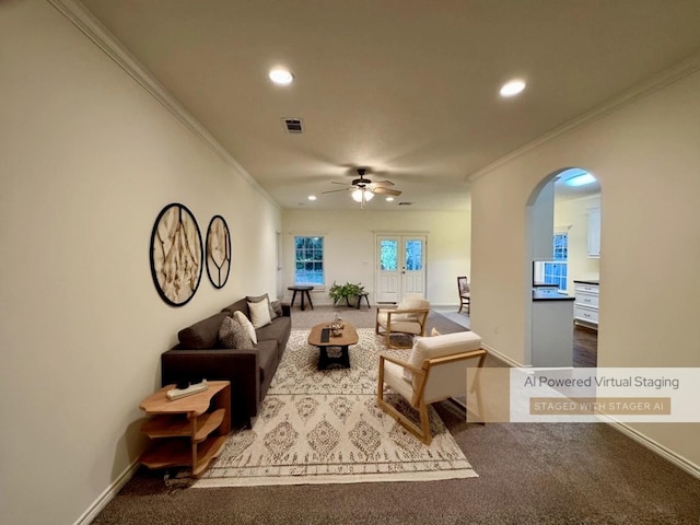 carpeted living room featuring ceiling fan, ornamental molding, and french doors