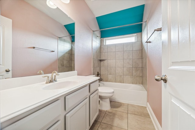 full bathroom featuring tile patterned floors, tiled shower / bath combo, toilet, and vanity