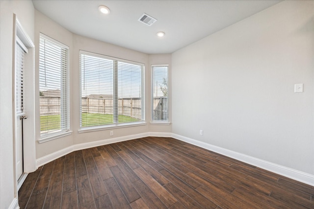 unfurnished room featuring dark hardwood / wood-style floors