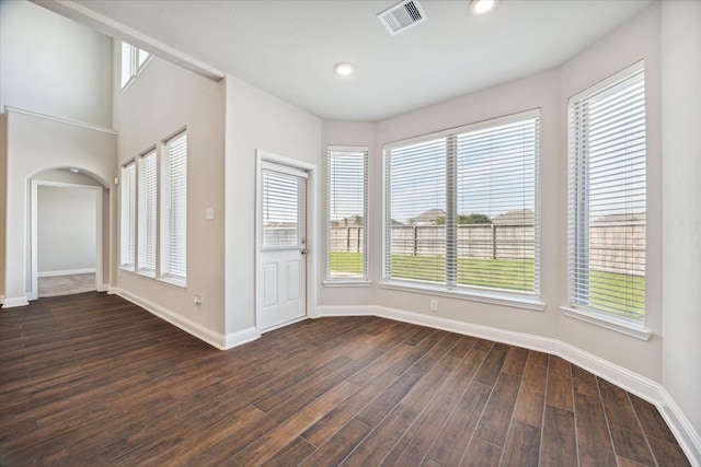 empty room featuring dark wood-type flooring