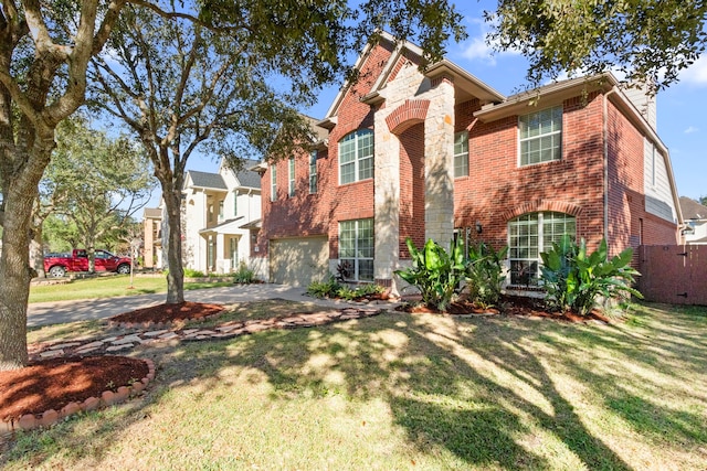 view of front of property featuring a garage and a front lawn