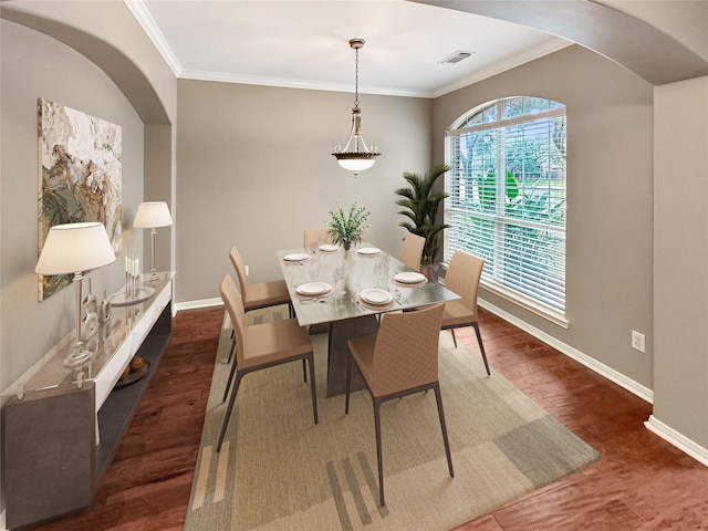 411 White Oak Pointe, League City, TX 77573 - dining room with arched walkways, visible vents, baseboards, and wood finished floors