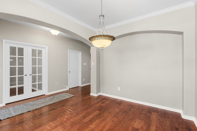 unfurnished room featuring french doors, dark hardwood / wood-style floors, and ornamental molding