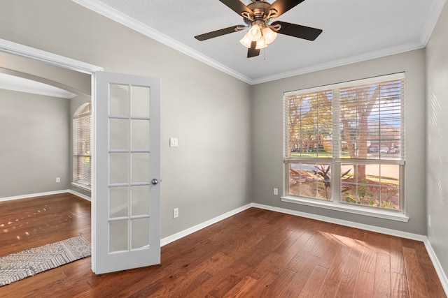 unfurnished room with wood-type flooring, ceiling fan, and crown molding