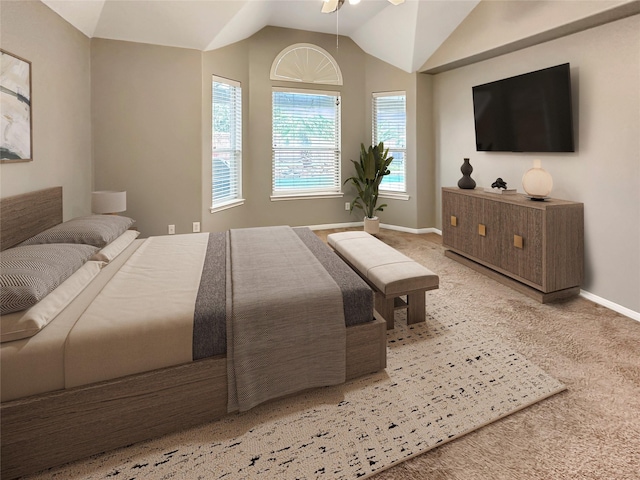 bedroom featuring carpet floors, vaulted ceiling, and ceiling fan