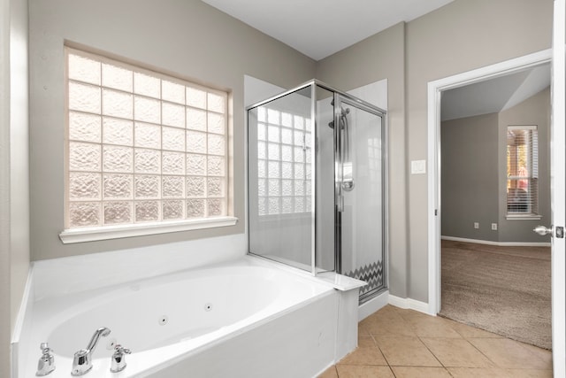 bathroom with tile patterned flooring and independent shower and bath