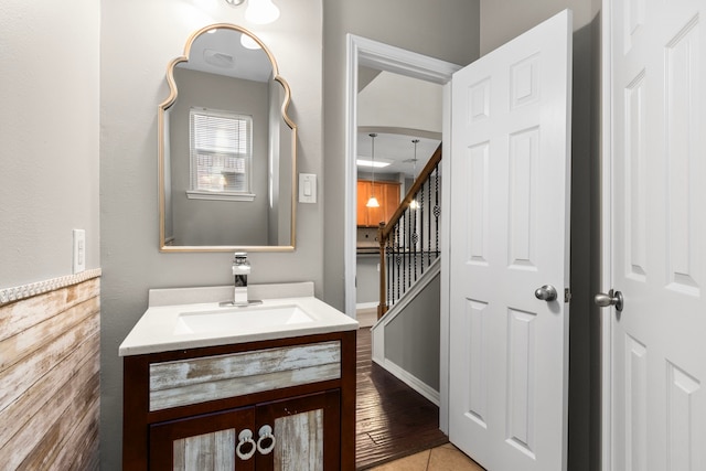 bathroom with hardwood / wood-style floors and vanity