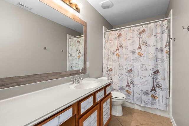 411 White Oak Pointe, League City, TX 77573 - full bath with tile patterned flooring, visible vents, toilet, a shower with curtain, and vanity