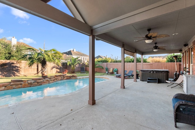 view of pool featuring ceiling fan, a patio, and a hot tub