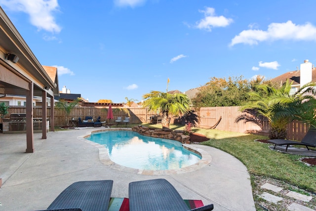 view of swimming pool with a patio